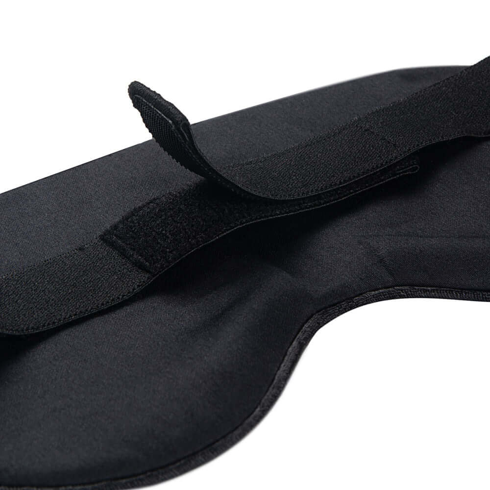 Close-up of Quietstore non-slip strap organic cotton sleep mask showing adjustable straps for a secure fit.