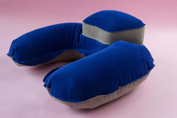 Inflatable U-shaped travel neck pillow with headrest in blue and gray, designed for comfort during travel.