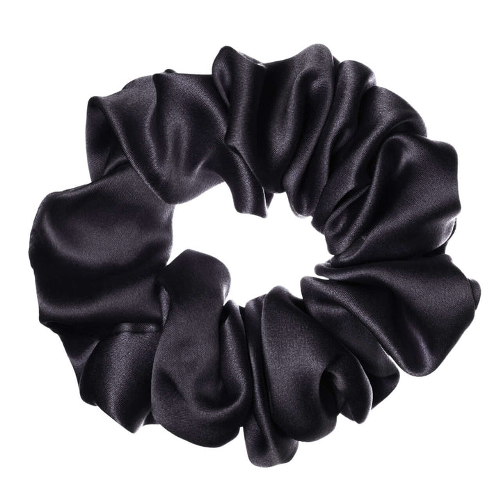 Pure mulberry silk scrunchie in black, featuring high elasticity and a smooth finish for all hairstyles.