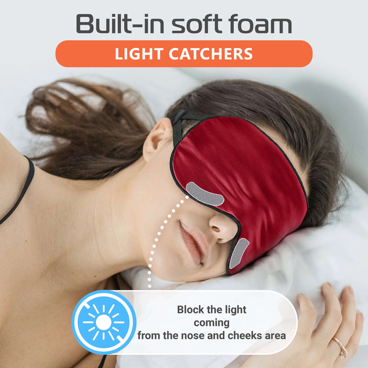 Silk sleep mask with built-in soft foam light catchers blocking light for better sleep.
