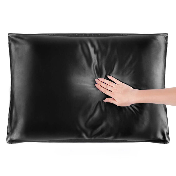 Quietstore silk pillowcase in black, showcasing soft texture and comfort for hair and skin rejuvenation.