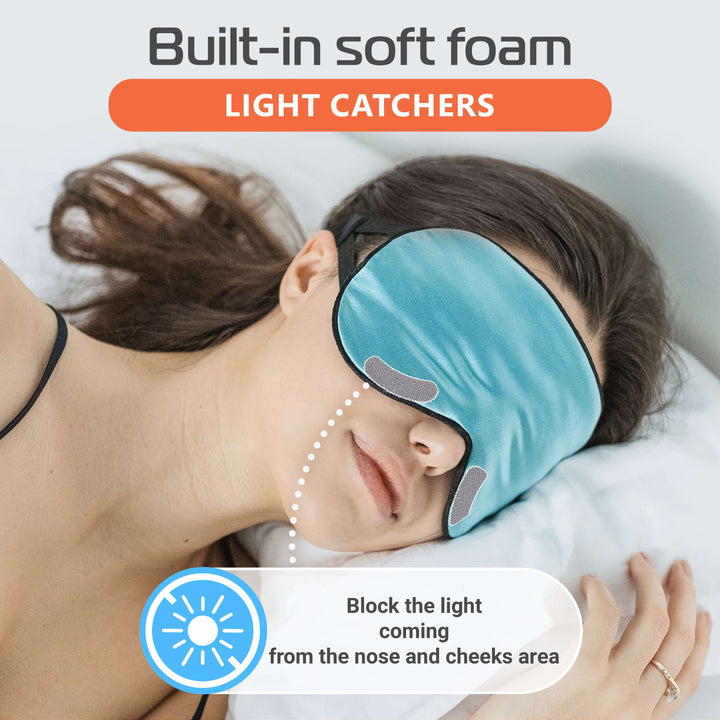 Woman wearing a silk sleep mask with soft foam light catchers, blocking light for deeper sleep.