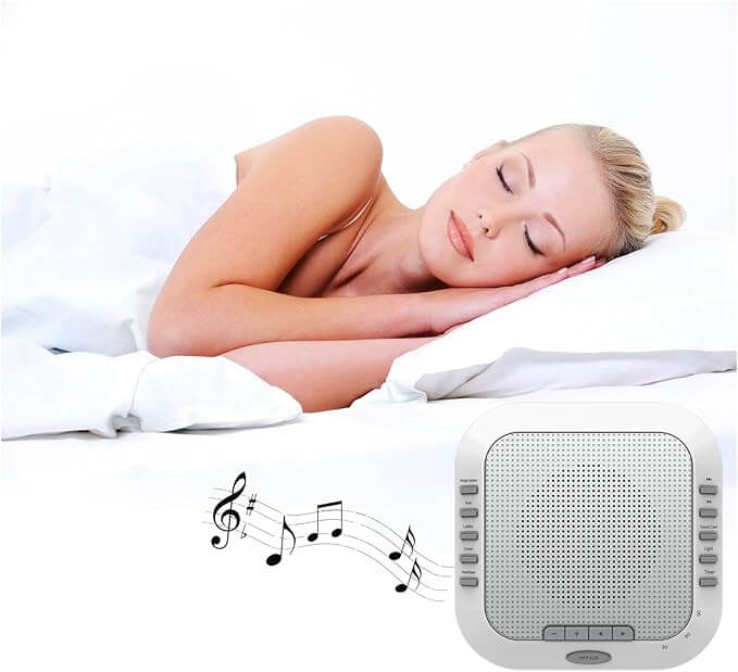 A woman sleeping peacefully beside a Three Sheep white noise sound machine, promoting restful sleep with soothing sounds.